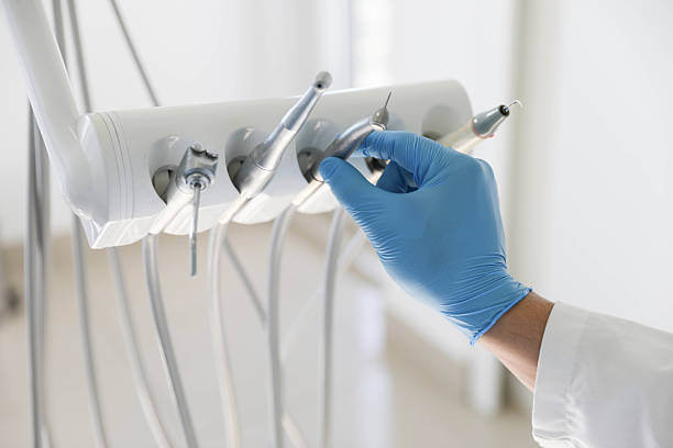 Professional Tooth Extraction technician working in Bastrop, TX